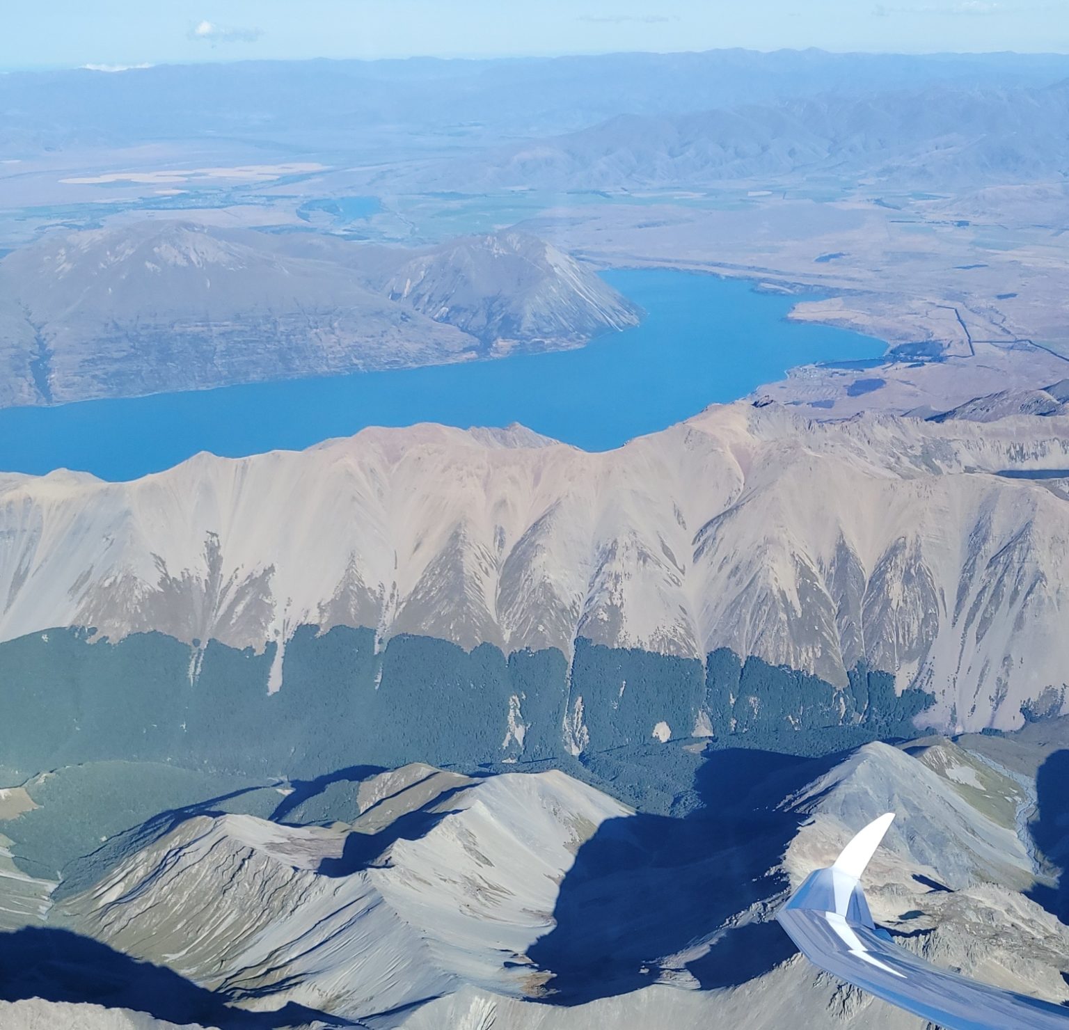 Glider above mountains in Otago